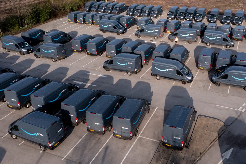 Aerial view of a parking lot of Amazon delivery vans